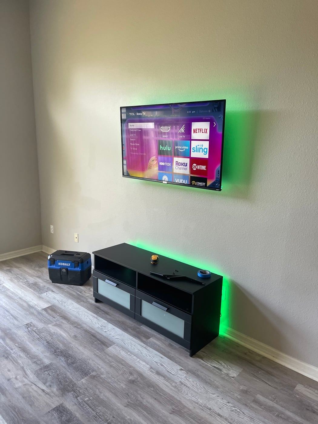 Wall-mounted TV with LED accent lighting